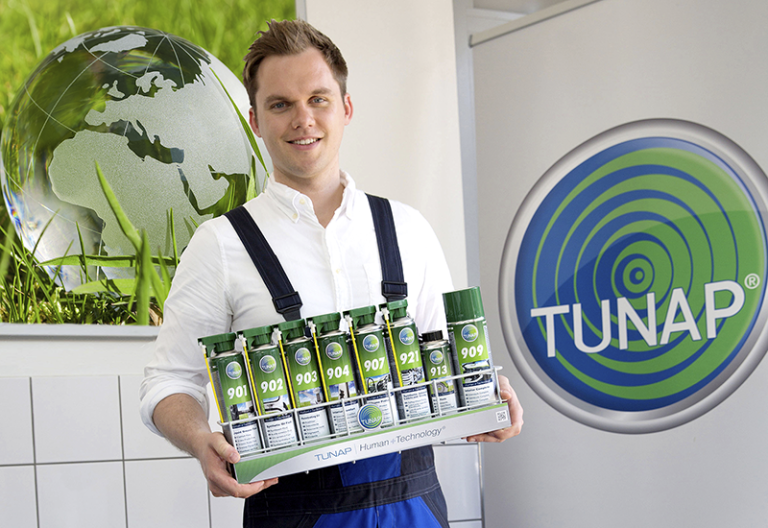 Human Technology Young mechanic presenting a set of well matched green spray cans